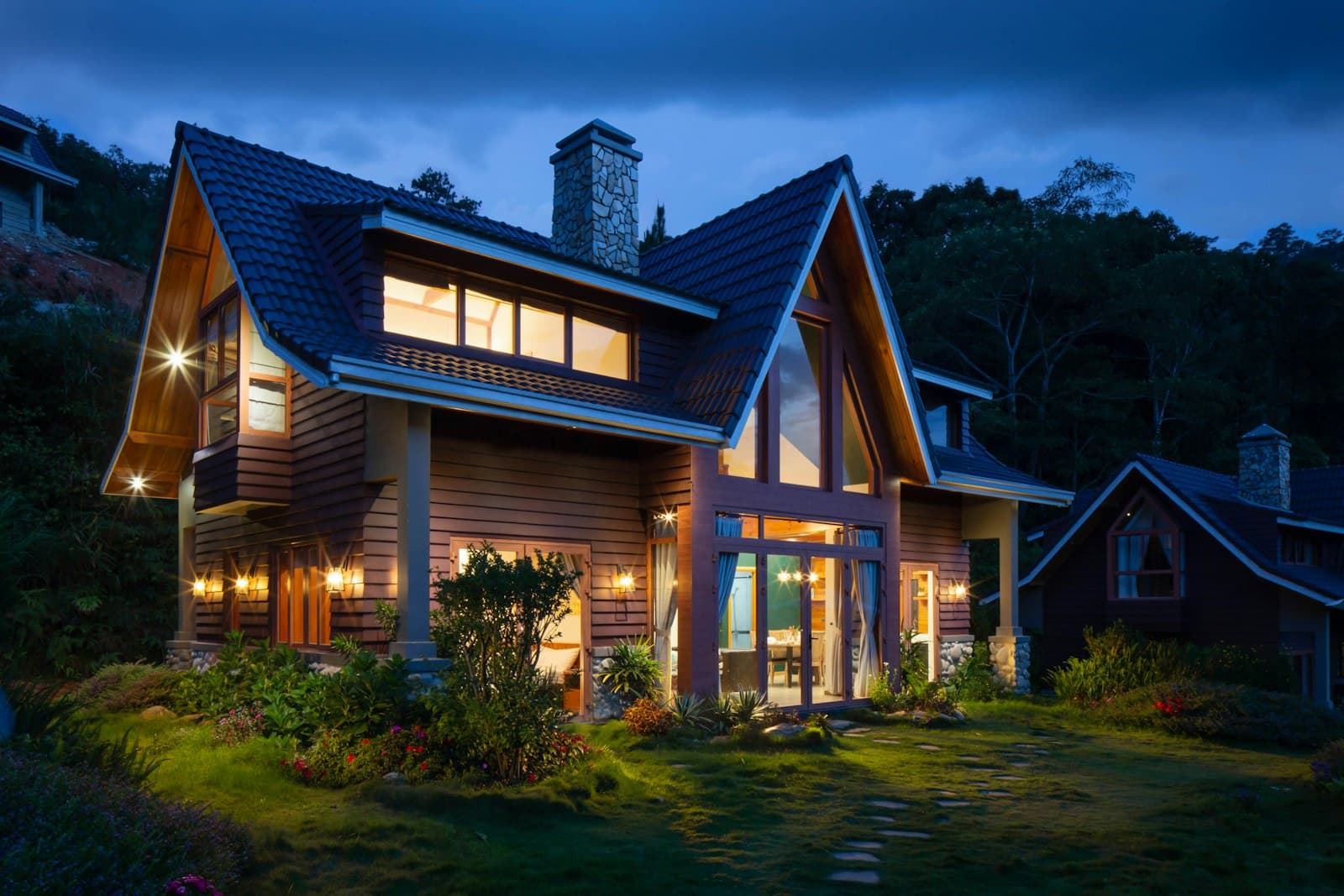 Craftsman home glowing at twilight