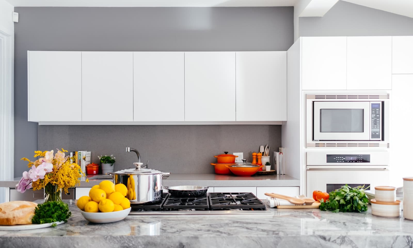 Bright staged kitchen with marble counters